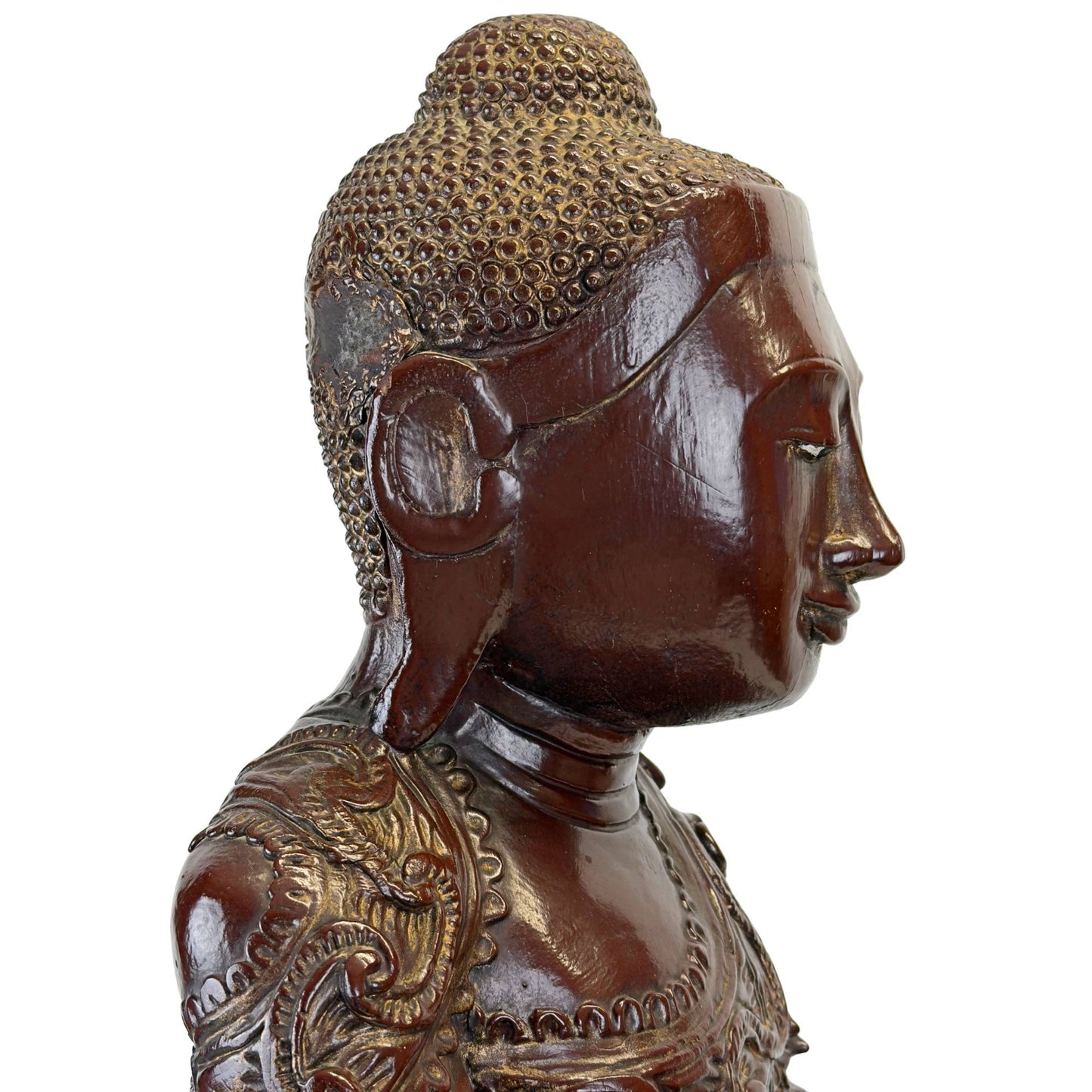 Linkes Profil des Gesichts einer antiken Buddha-Statue aus Mandalay mit originaler Blattvergoldung