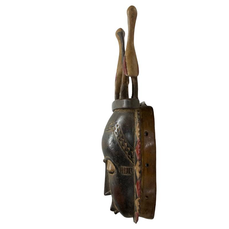 51 cm große, bauleartige Maske aus Elfenbein von der Küste, mit Bissblock, Patina, linksseitig.