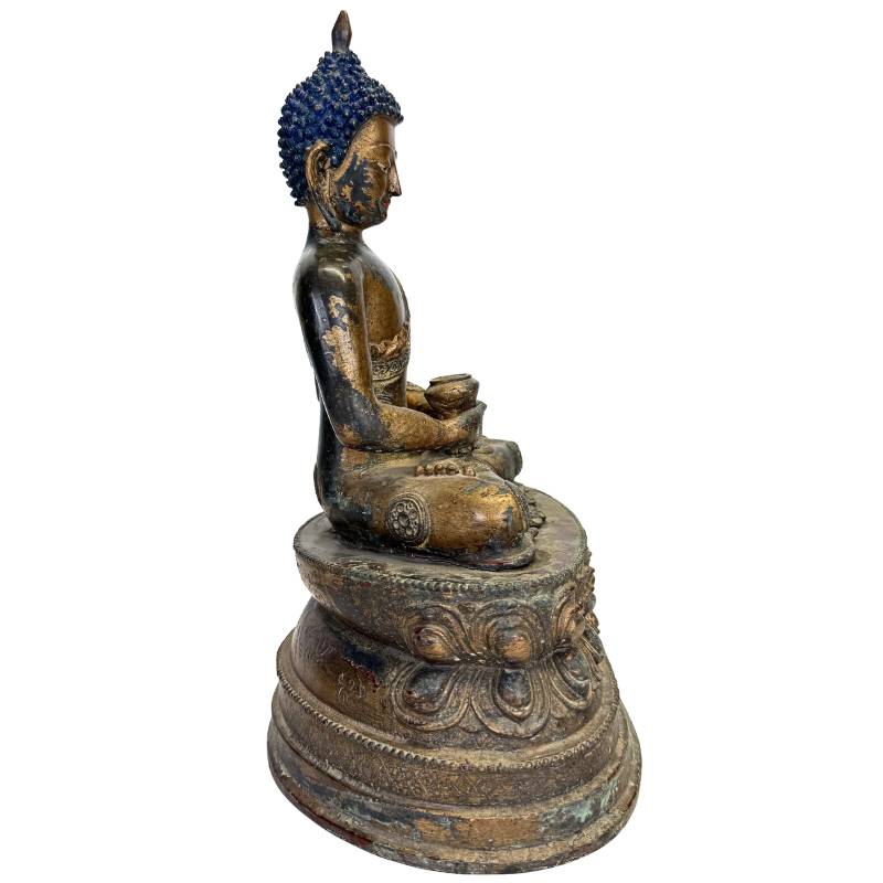 Buddha-Statue mit Medizinschale und traditionellem blauen Haar