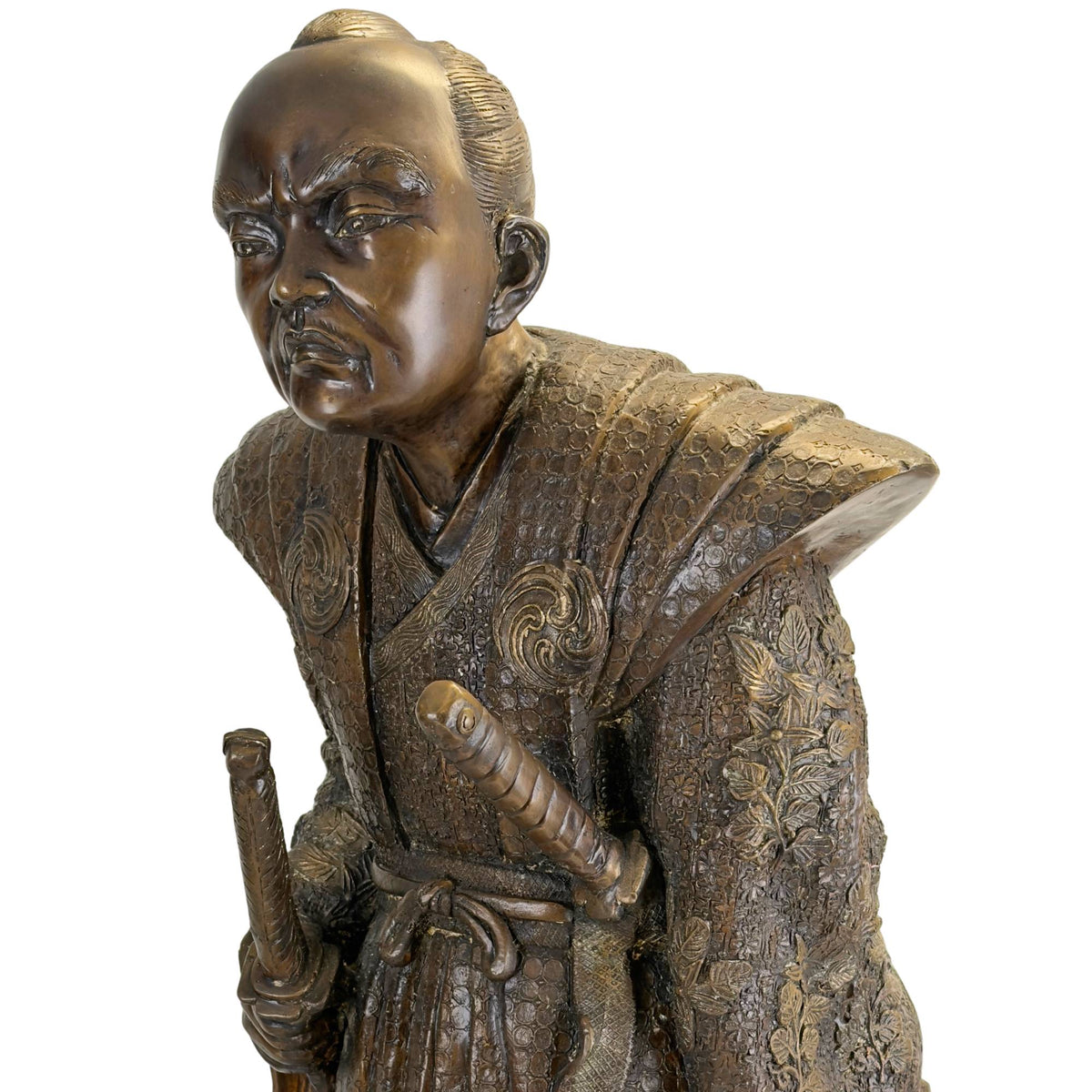 Close-up of the upper body focusing on the crossed collar of the kimono and the Tomoe-mon family crests on the chest.