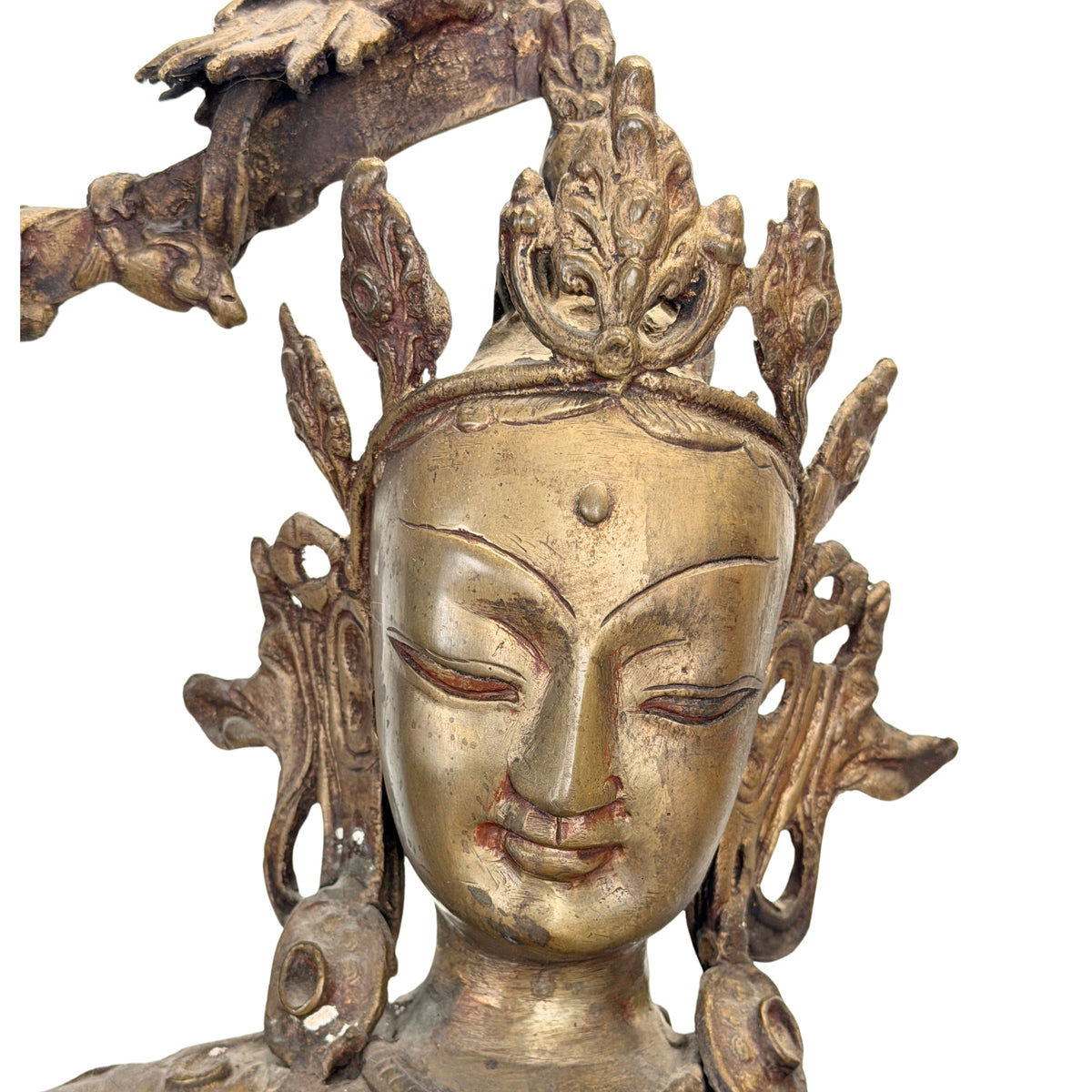 Antieke Nepalese Manjushri – detail van het gezicht, de kroon en oorornamenten