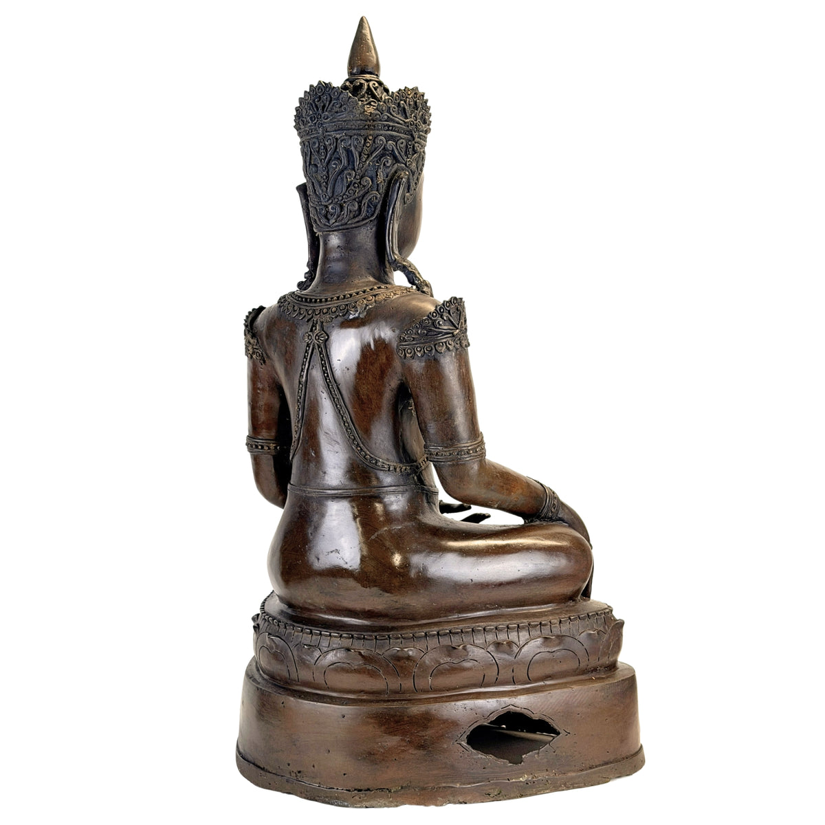 Full rear view of the antique Thai crowned Buddha in bronze