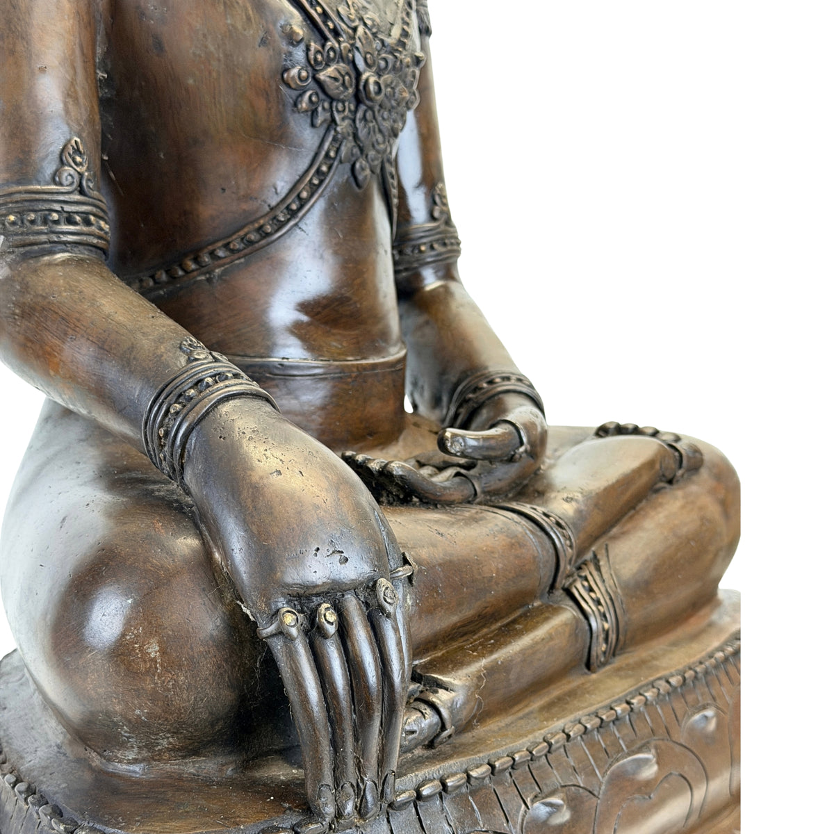 Detail of the Bhumisparsha hand and knee of the antique Thai Buddha