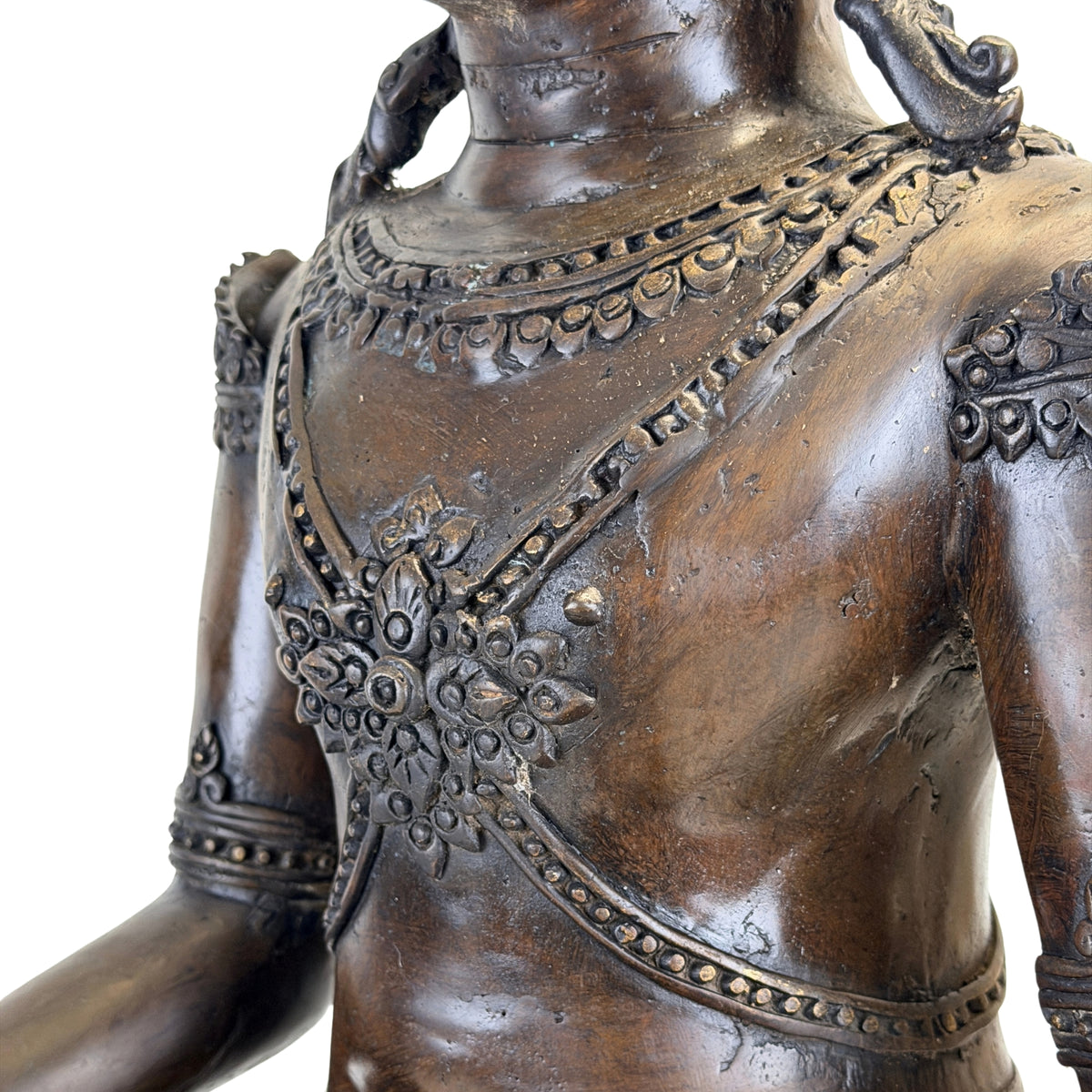 Detail of chest necklace and ornament on the antique Thai Rattanakosin Buddha