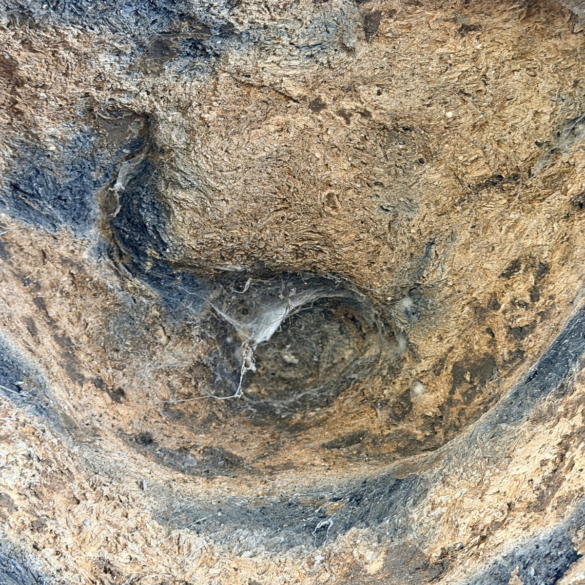 Detail of the old earthen and clay casting core inside the antique Thai Buddha