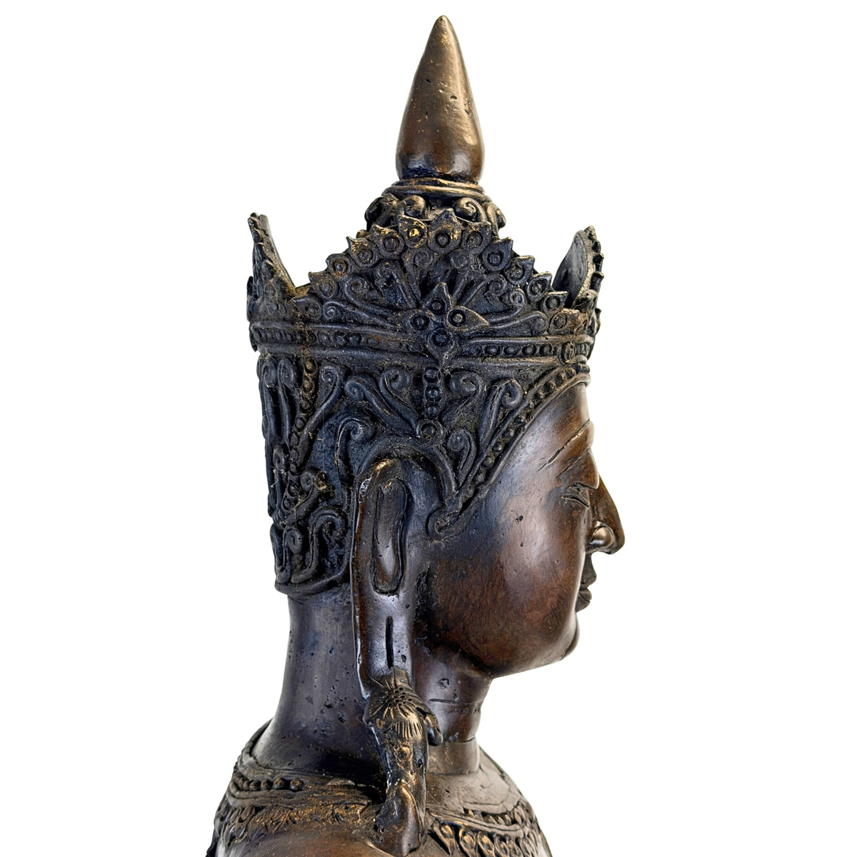 Profile of the tall richly decorated crown of the antique Thai Rattanakosin Buddha