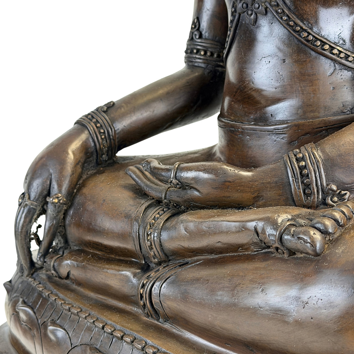 Detail of hands, legs and Bhumisparsha mudra of the antique Thai Buddha