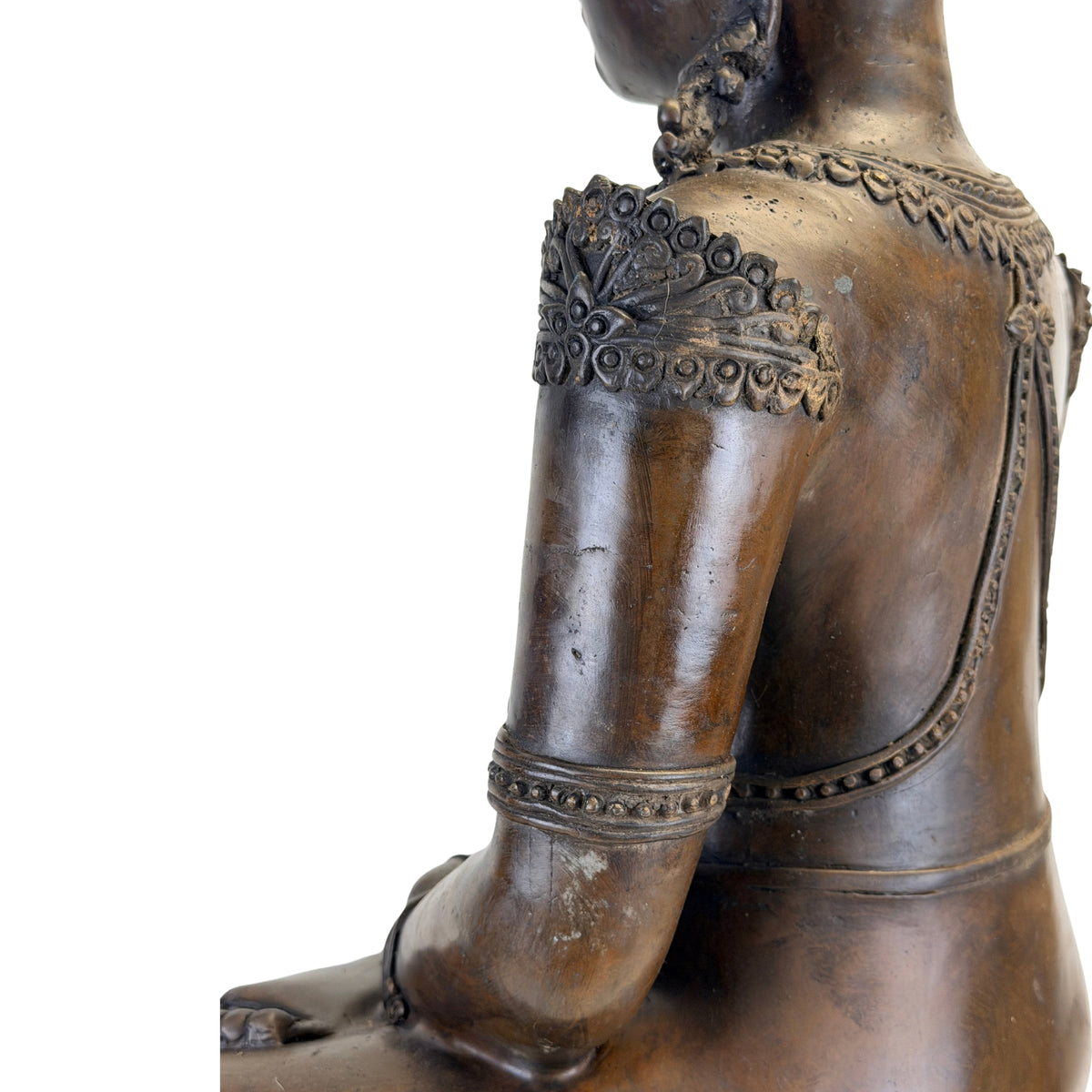 Detail of right arm, shoulder and back of the antique Thai bronze Buddha