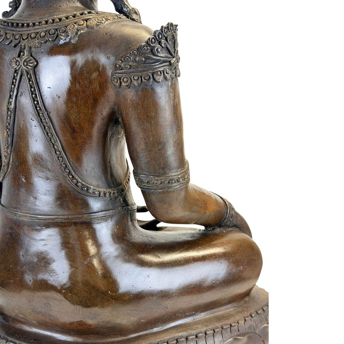 Right side view of the back and arm of the antique Thai bronze Buddha