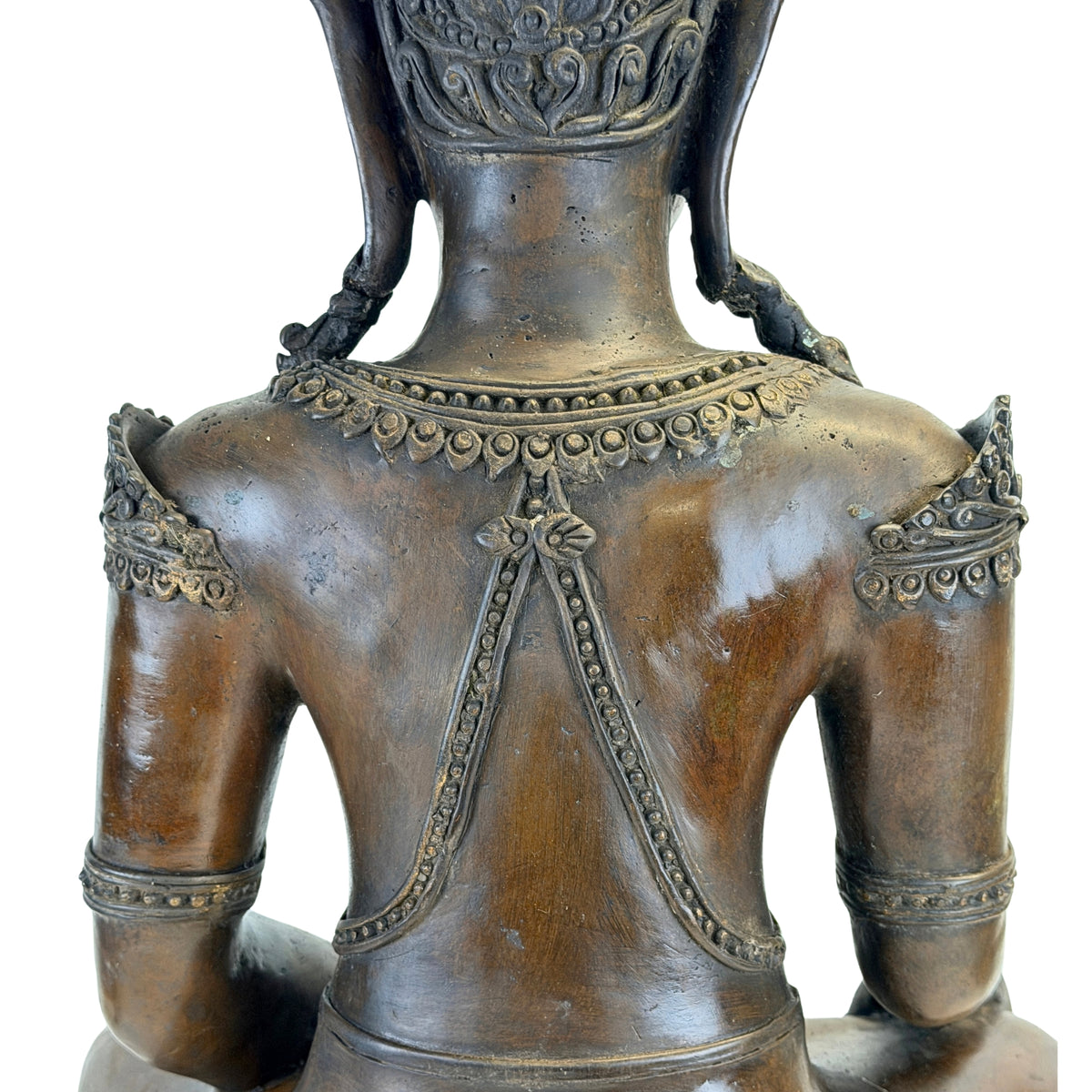 Detail of back, necklace and shoulder ornaments on the antique Thai Buddha