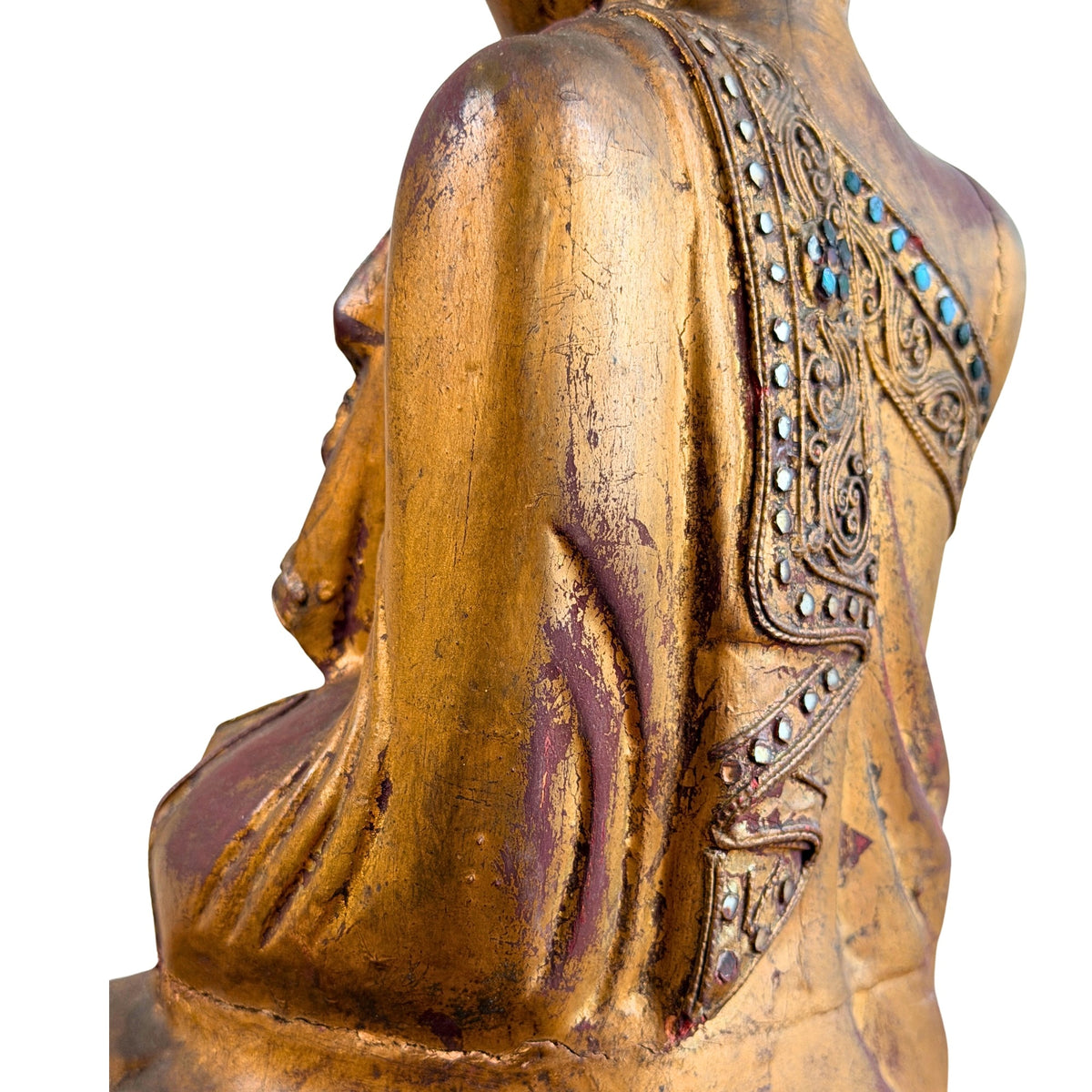 Rückprofil des Buddha-Kopfes mit Haarlocken und langem Ohrläppchen