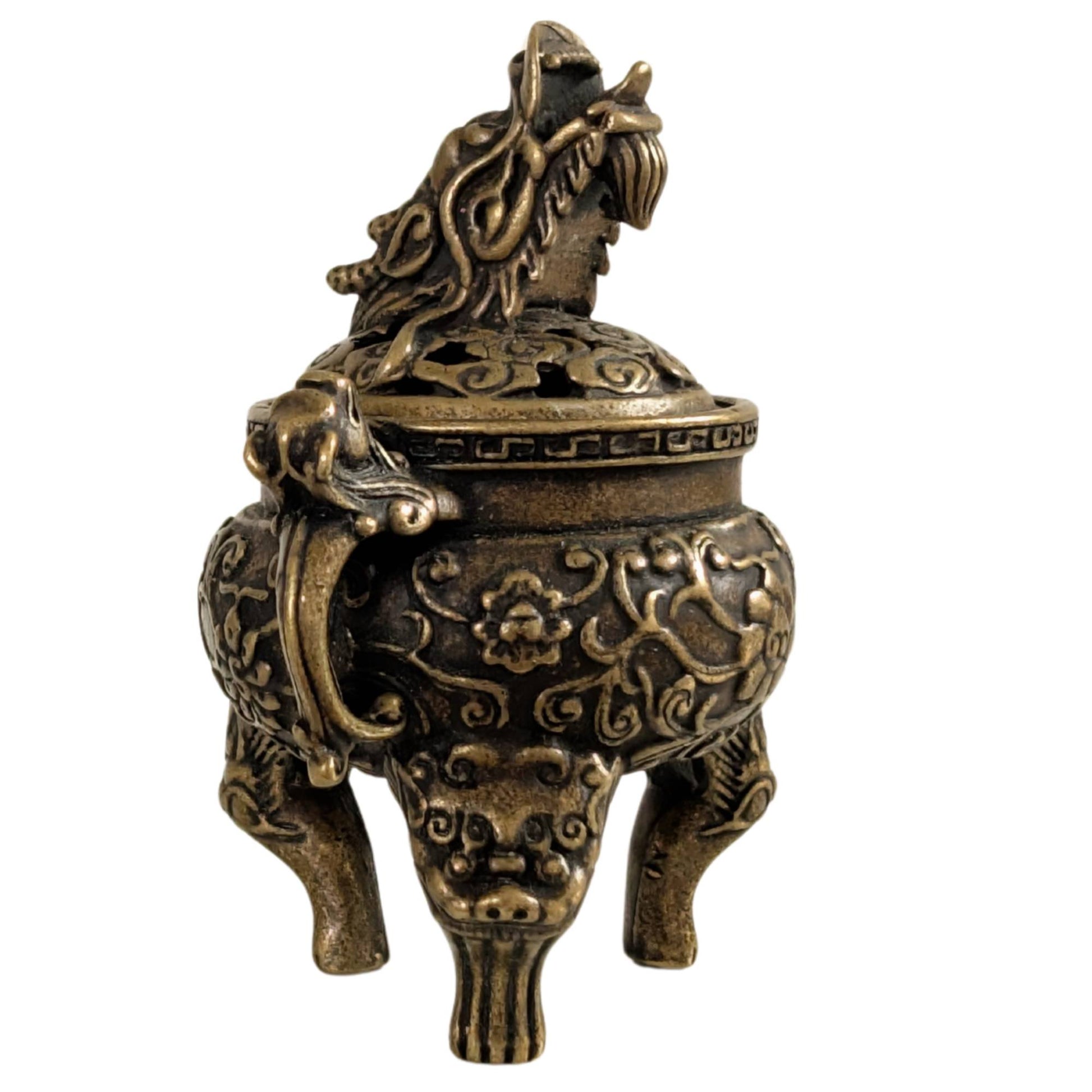 Kleiner bronzener Dreifuß-Räucherbehälter mit durchbrochenem Deckel und traditionellen Motiven.