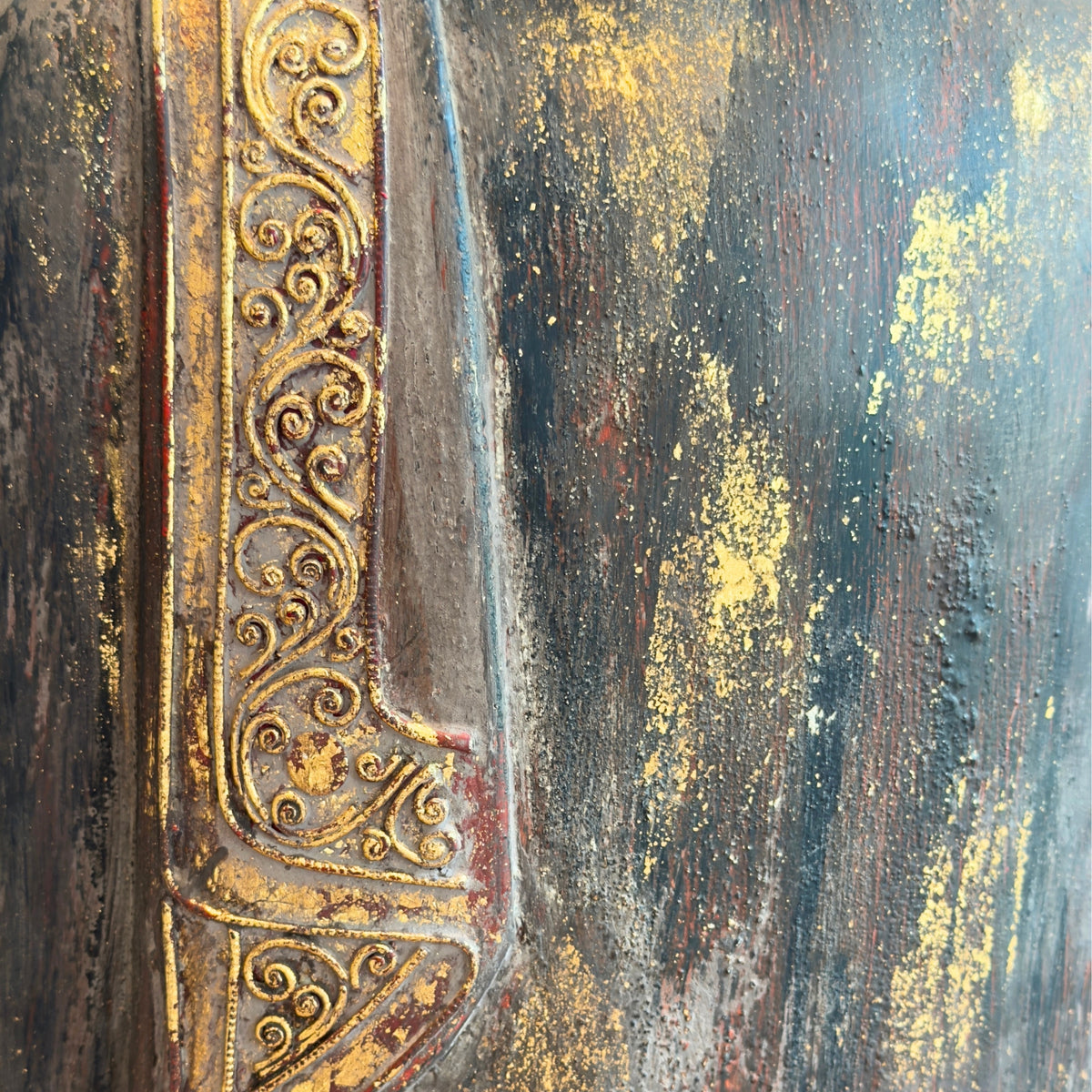 Detail of original gilding on the robe of an antique Burmese Buddha