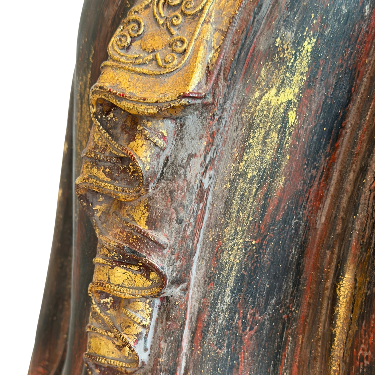 Detail of richly decorated garment with remnants of original gilding on a Burmese Buddha