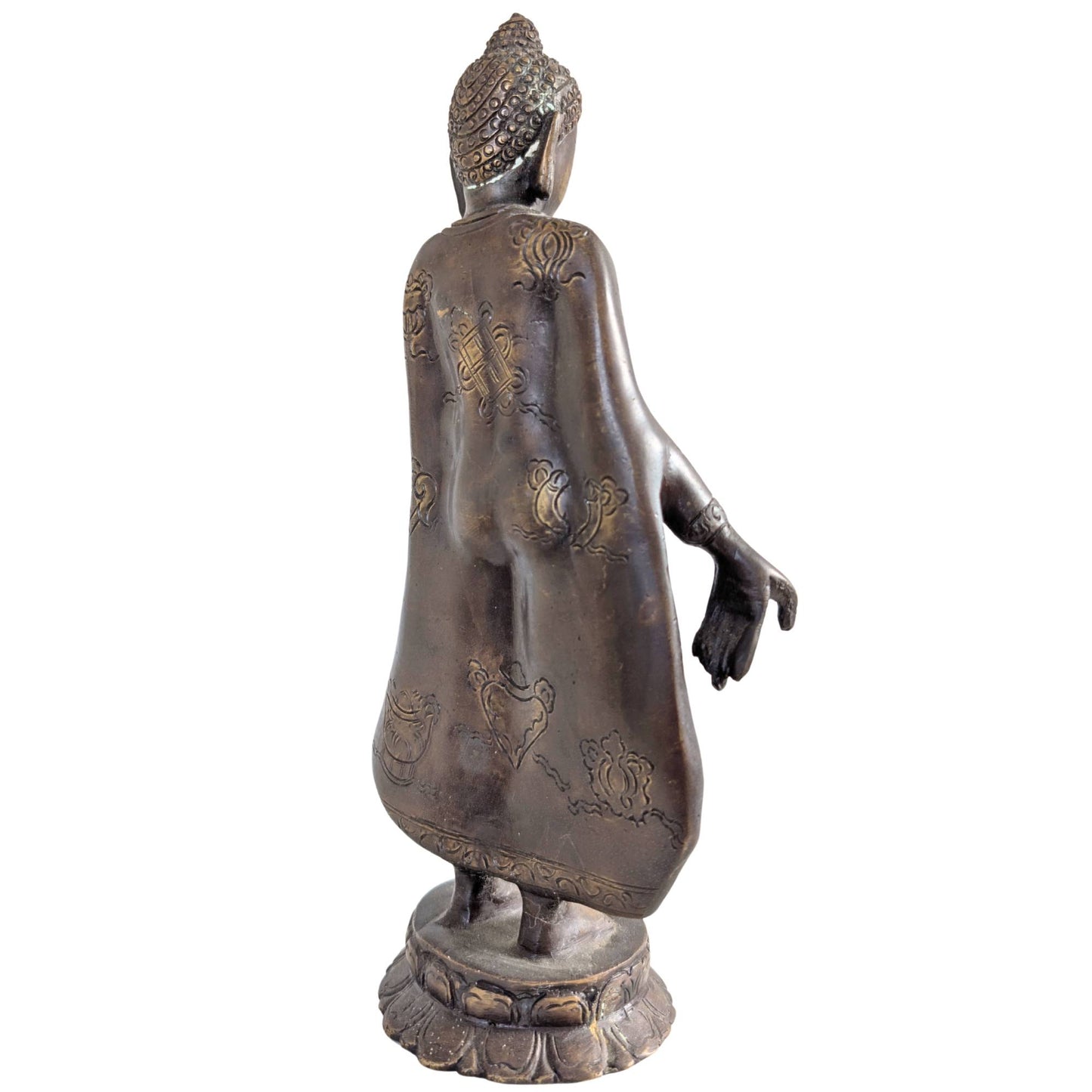 Reich verzierte symbolische Gravuren auf der Rückseite der bronzenen Buddha-Statue.