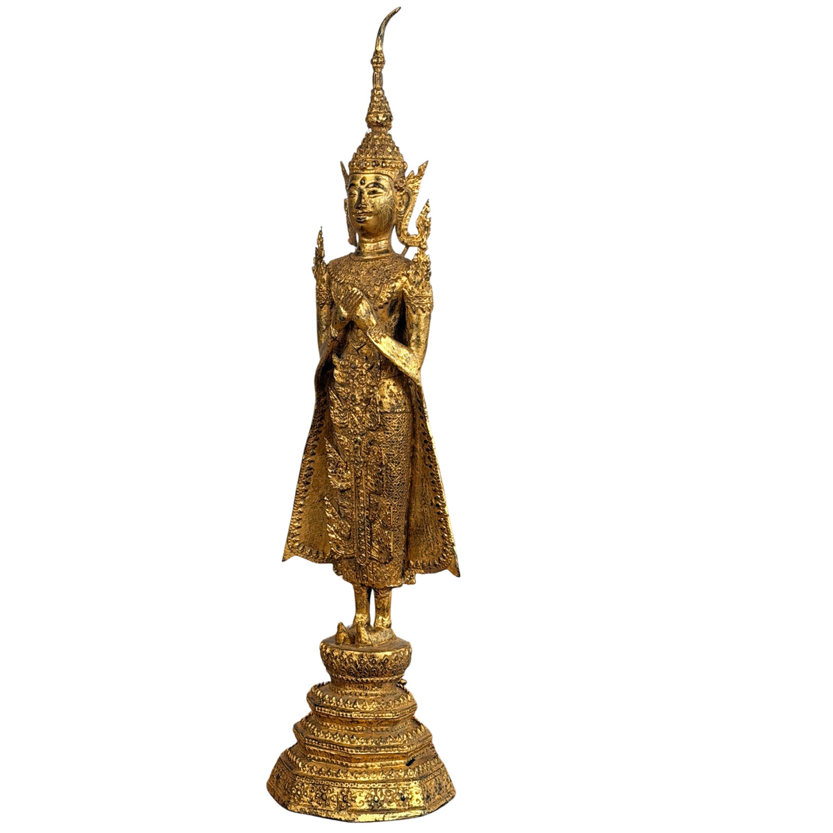 Angled front view of the standing Buddha on its lotus base