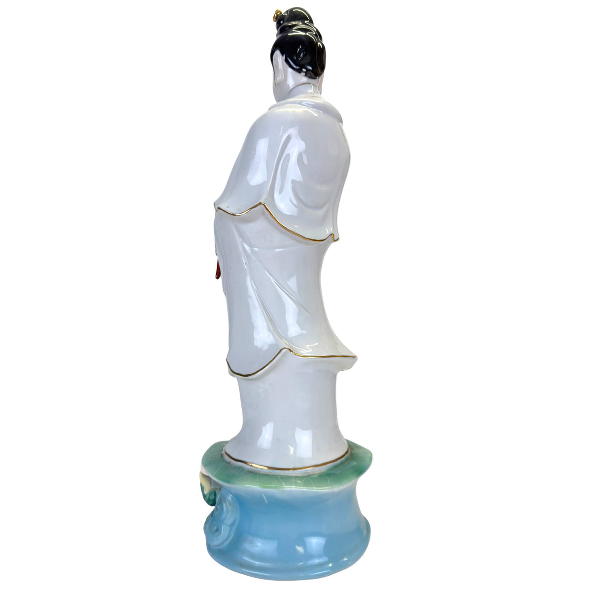 Hand-painted lotus pedestal in pastel colors at the base of a large sculpture.