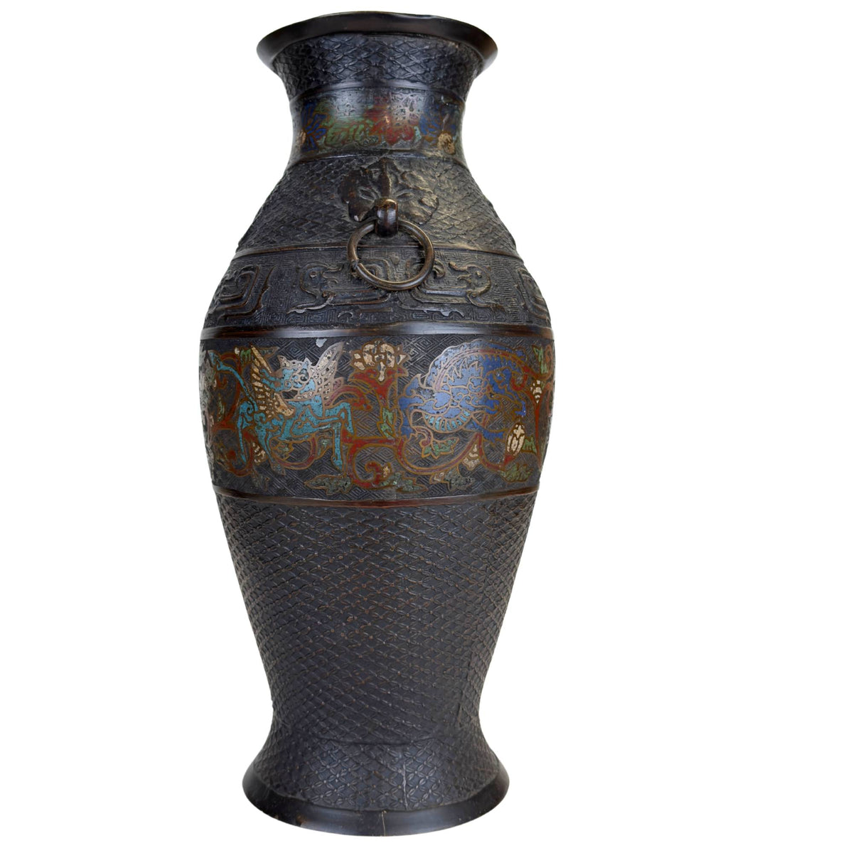 Detail of Japanese champlevé vase with blue mythical creature, floral enamel decoration and fine geometric pattern in the bronze
