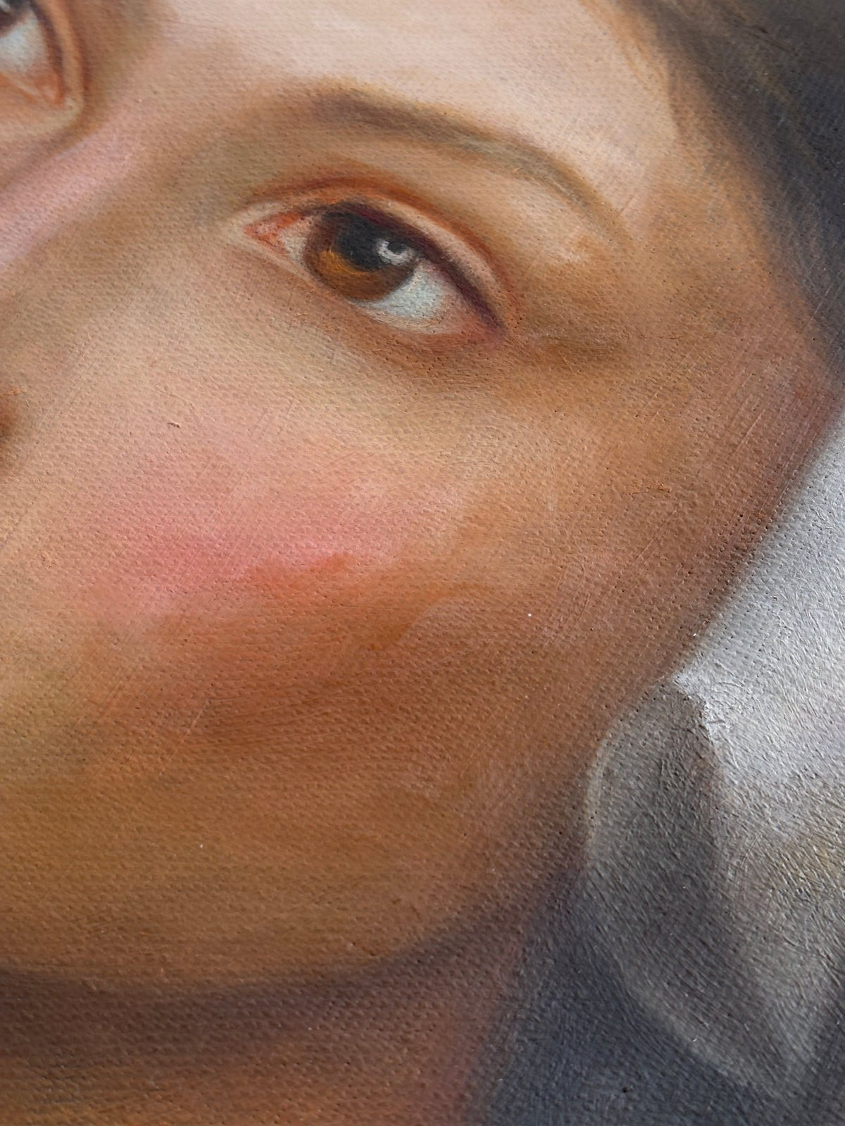 Close-up of the eyes and the meticulous brushwork that brings the gaze to life.