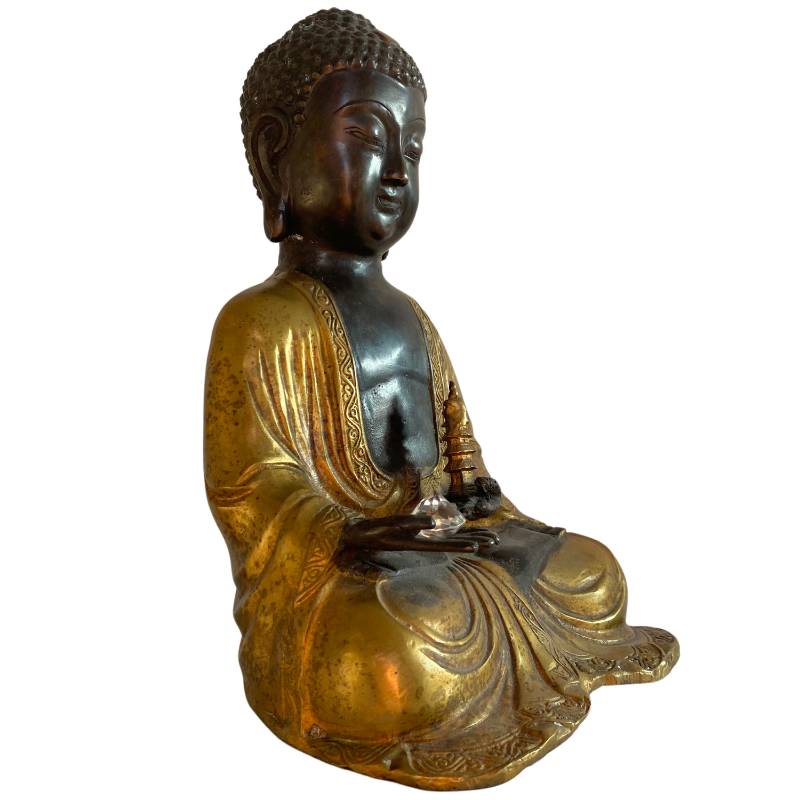 Bronzebuddha aus Nepal in Meditationshaltung mit Vergoldung und Patina.