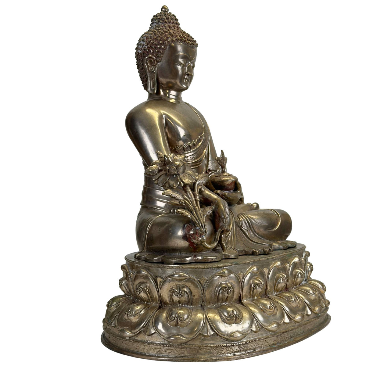 Antiker Newar Bhaisajyaguru Medizin‑Buddha in Dreiviertelansicht mit monumentalem doppelten Lotus‑Thron, Medizinpflanze und natürlicher Patina.