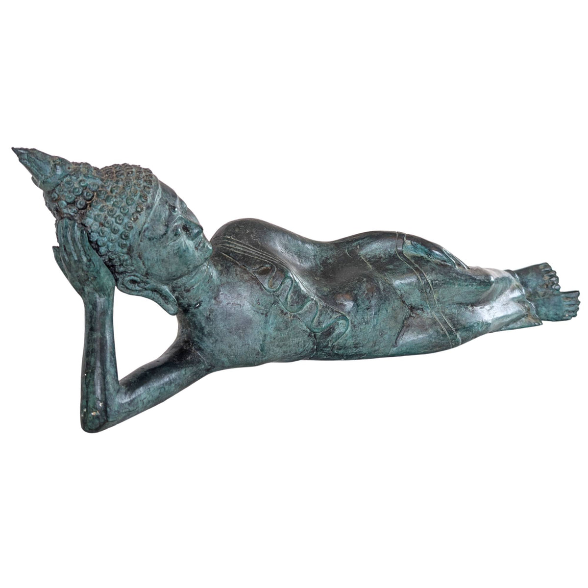 Side view of an antique bronze lying Buddha from Thailand with a slender body shape