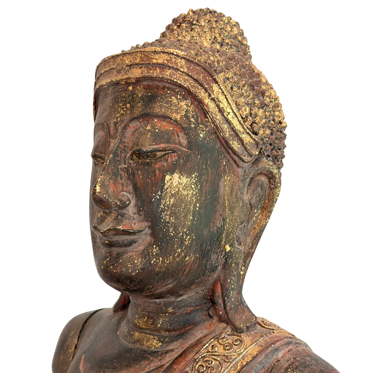 Close-up of the face of an antique Burmese Buddha with original lacquer and gilding