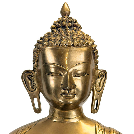 Detail des friedlichen Gesichts des antiken bronzenen Shakyamuni Buddha.