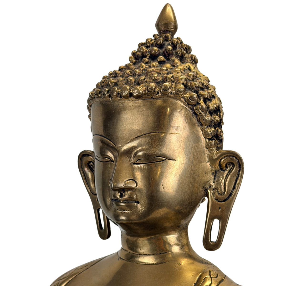 Detail des Gesichts und der langen Ohrenflügel von Shakyamuni Buddha.