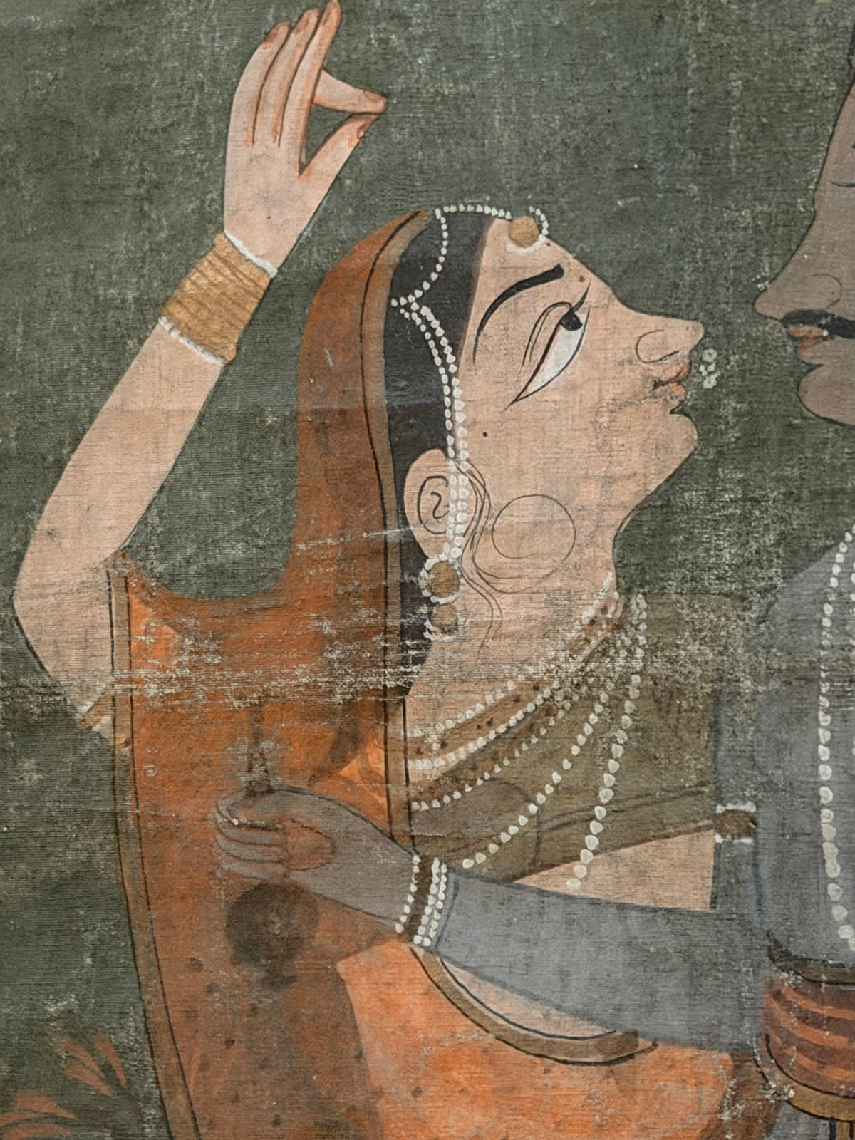 traditional Indian painting of Krishna with female figures