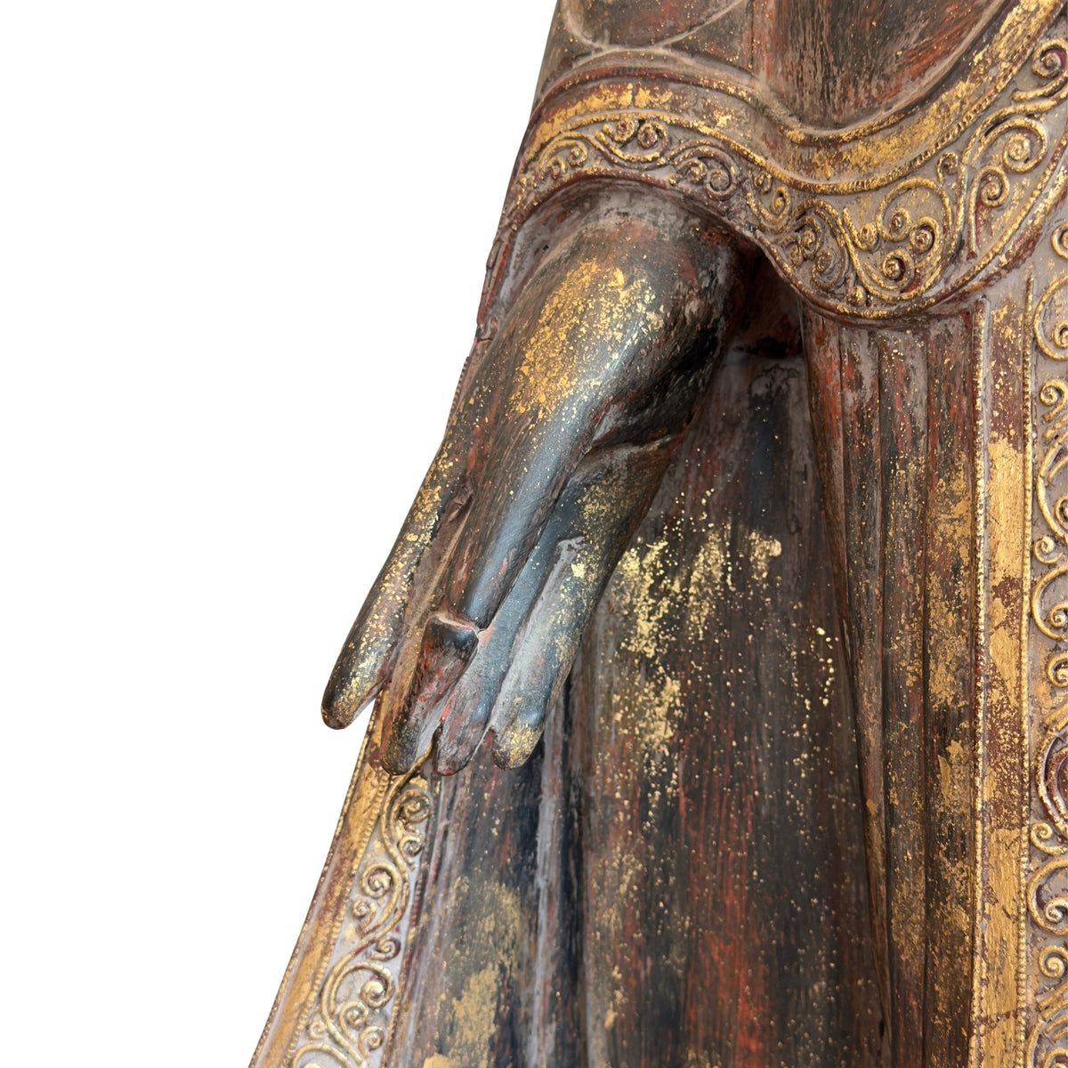 Traditional lacquer layers on an antique teak Buddha from Myanmar