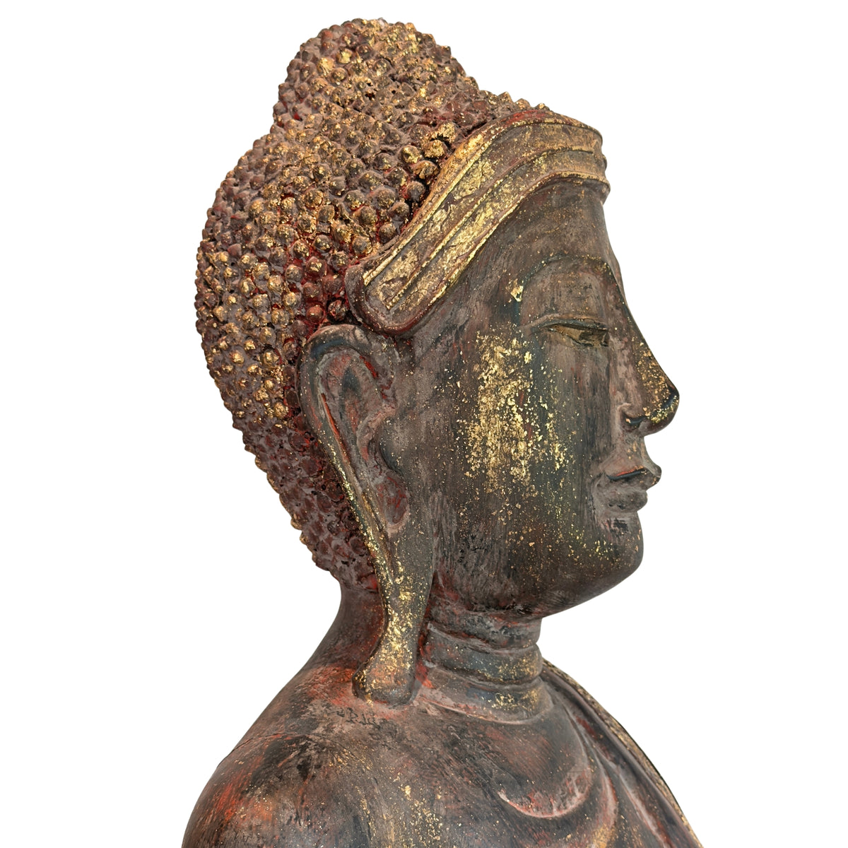 Side view of the head of an antique Burmese Buddha from Myanmar