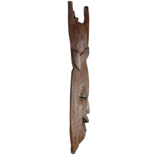 Seitenansicht der 2 kg schweren Maske aus massivem afrikanischem Hartholz, die sich perfekt als exklusive Wanddekoration eignet.